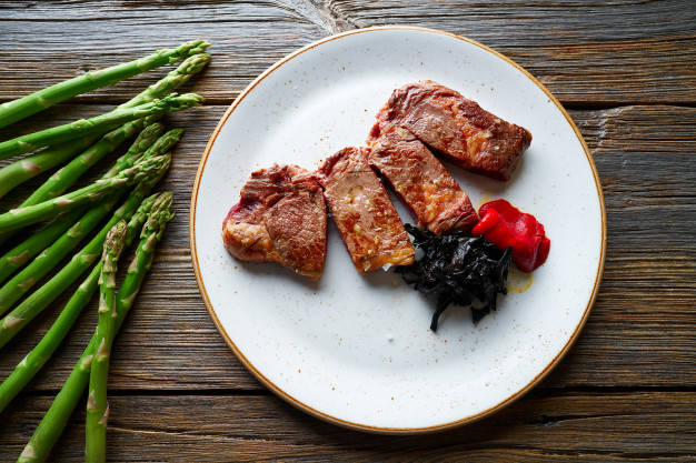 grilled-beef-tenderloin-with-piquillo-peppers_79295-6990