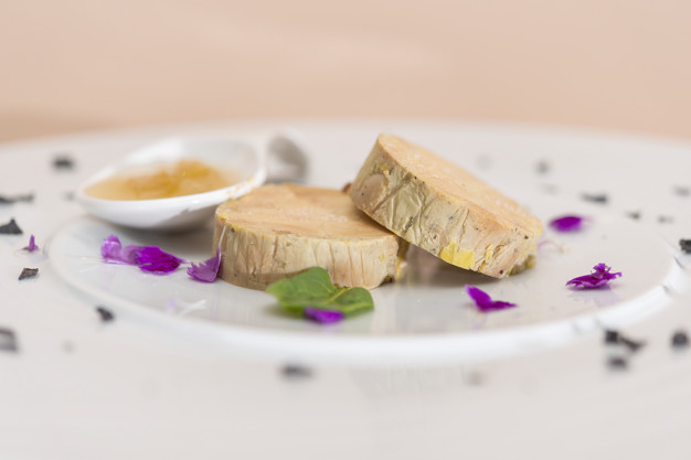 Liver terrine served with sweet sauce, decorated with flower pe