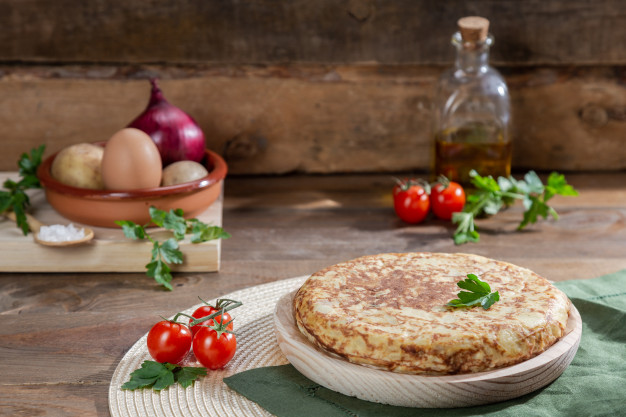 traditional-spanish-omelette-wooden-table_138656-70