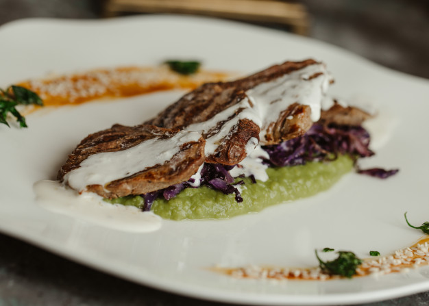 grilled-eggplant-slices-with-pesto-yogurt-sauce_114579-2129