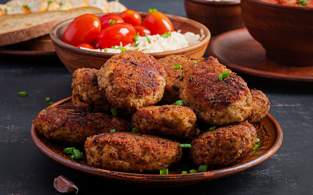 juicy-delicious-meat-cutlets-dark-table_2829-3478